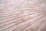 Radius Beige kerek gyapjú szőnyeg szálszerkezete közelről
